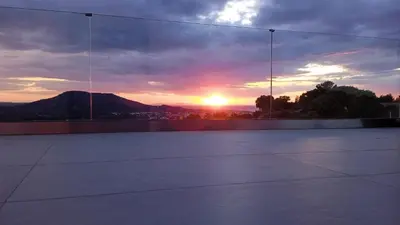 a view of a sunset from a tennis court at Sunset Villa Rhodes in Ixia