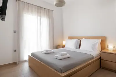 a bedroom with a bed with two towels on it at Irene Gem in Rhodes Town