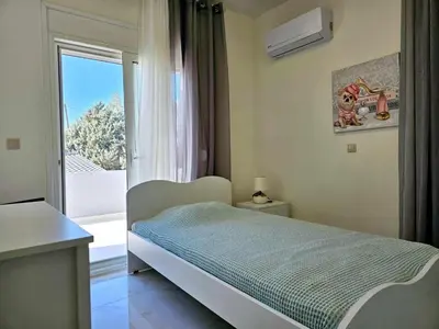 a bedroom with a bed and a large window at Dream Luxury Suites & Apartment Pastida in Pastida