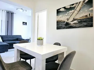 a living room with a white table and chairs at Dream Luxury Suites & Apartment Pastida in Pastida