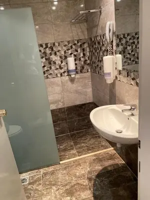 a bathroom with a sink and a shower at Cyprotel Faliraki in Faliraki