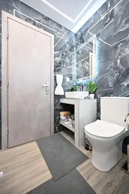 a bathroom with a toilet and a sink at Sea & Joy Studio in Ialyssos