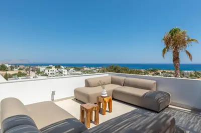 a living room with couches and a view of the ocean at Luxurious Villa with sea views in Gennadi Rhodes in Gennadi