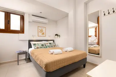 a bedroom with a bed with two towels on it at Dora 3 bedroom apartment in Rhodes Town