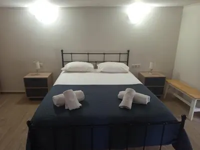 a bedroom with a bed with two towels on it at Villa Oasis 3 in Kalithies