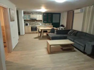 a living room with a couch and a table at Villa Oasis 3 in Kalithies
