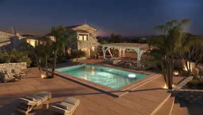 a swimming pool in front of a house at Villa Oasis 3 in Kalithies
