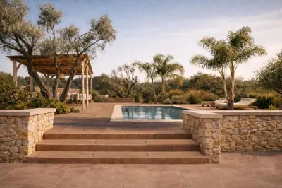 a swimming pool with stairs and a stone wall at Villa Oasis 3 in Kalithies