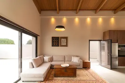 a living room with a couch and a table at Luma Villas in Rhodes Town