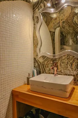 a bathroom with a white sink and a mirror at 
