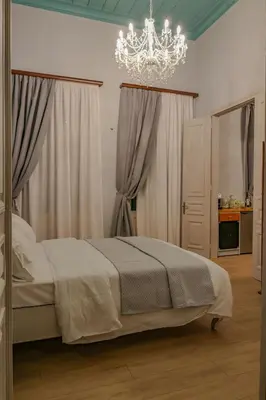a bedroom with a bed and a chandelier at 