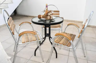 a black table with chairs and a bowl on it at Casa 30 House Complex Center of Ialysos in Ialyssos