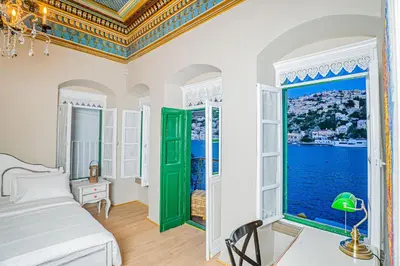 a bedroom with a bed and a large window at 