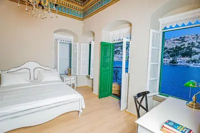 a bedroom with a bed and a large window at 
