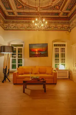 a living room with a couch and a table at 