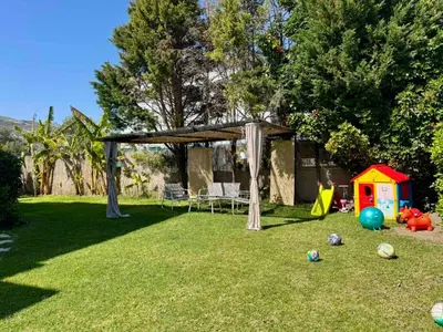a backyard with a gazebo and a play house at Papas house 2 near Faliraki kalithies in Kalithies