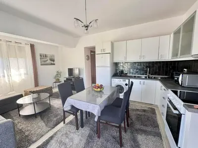 a kitchen and dining room with a table and chairs at Papas House 3 near Faliraki Kalithies in Kalithies