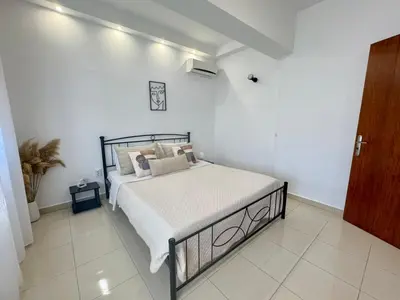 a bedroom with a bed in a white room at Papas House 3 near Faliraki Kalithies in Kalithies