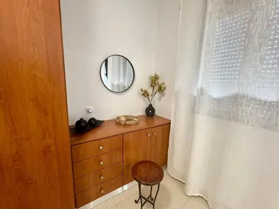 a mirror on top of a dresser in a room at Papas House 3 near Faliraki Kalithies in Kalithies