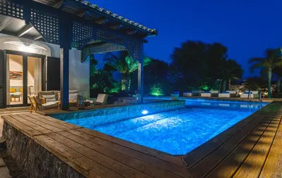 a swimming pool in a villa at night at Mi Casa South Rhodes in Lachania