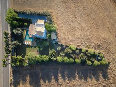 an aerial view of a yard with trees and a house at Mi Casa South Rhodes in Lachania