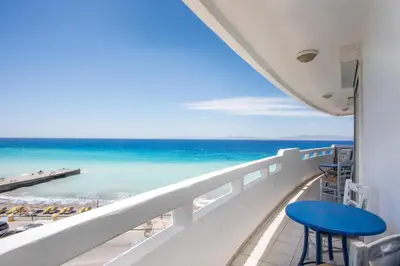 a balcony with a view of the ocean at Molos Seaside Apartment in Rhodes Town