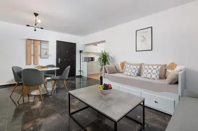 a living room with a couch and a table at Elli City Apartment in Rhodes Town