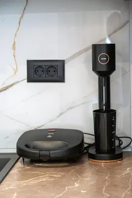 a black router sitting on top of a table at The Azure Suites in Haraki