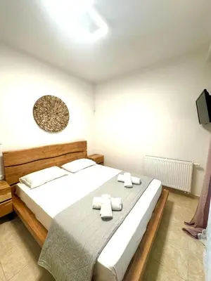 a bedroom with a bed with two towels on it at Rhodes Villa 365 in Rhodes Town