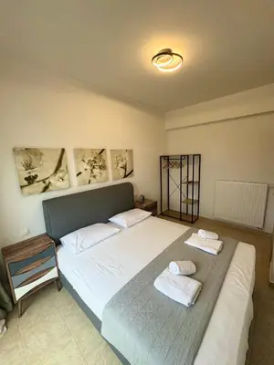 a bedroom with a bed with two towels on it at Rhodes Villa 365 in Rhodes Town