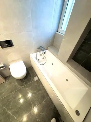 a white bathroom with a toilet and a sink at Rhodes Villa 365 in Rhodes Town