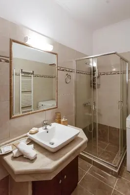 a bathroom with a sink and a shower at Villa Afandou Bliss with private pool & panoramic sea view in Afantou