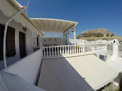 a view from the balcony of a house at Eleni Boutique Apartment in Líndos