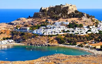 an island with a castle on top of a hill at Lindos Anatoli Luxury Villa in Líndos