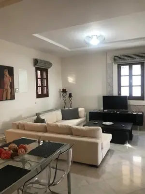 a living room with couches and a piano at Lindos Anatoli Luxury Villa in Líndos