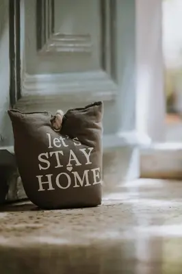 a pillow sitting on the floor in front of a door at Leoni's House near the Beach in Kremasti