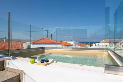 a swimming pool on the roof of a building at Casa della Nonna Rhodes in Gennadi