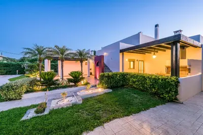 a house with a garden in front of it at Filerimos Oasis Villa in Ialyssos