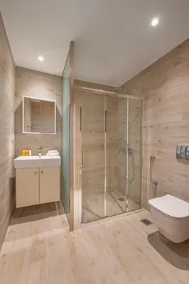 a bathroom with a shower and a toilet and a sink at City Choice 2 Live - Sofouli 15 in Rhodes Town