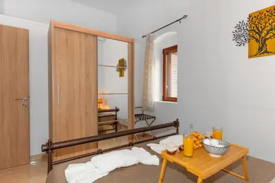 a room with a table with towels on a bed at Casa Di Kritinia in Kritinía