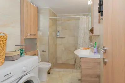 a bathroom with a shower and a toilet and a sink at Casa Di Kritinia in Kritinía