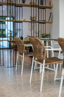 a table and chairs in a room with a table and chairsktop at Nikos BnB in Faliraki