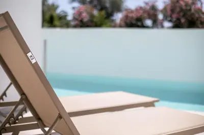 a chair sitting on top of a table at Nikos BnB in Faliraki