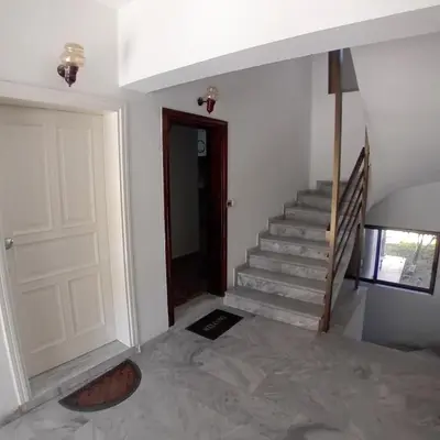 a room with a staircase with a door and a stair case at Dioni of Rhodes in Rhodes Town