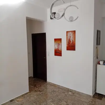 a white room with two pictures on the wall at Dioni of Rhodes in Rhodes Town