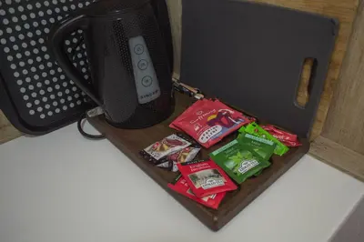 a suitcase filled with packets of chips and snacks at Sunrise Apartments in Livadia