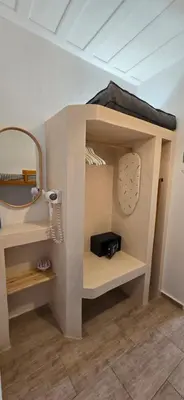 a bunk bed in a room with a mirror at Sunrise Apartments in Livadia