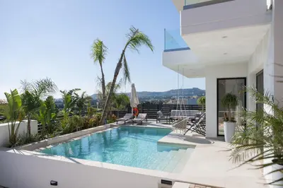 a swimming pool on the balcony of a house at Blue Hills Villa in Kallithea Rhodes