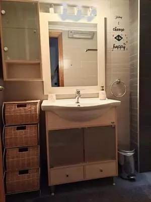 a bathroom with a sink and a mirror at Bella Vita Ixia in Ixia