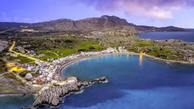 an aerial view of a beach and the ocean at néreya luxury rooms in Haraki